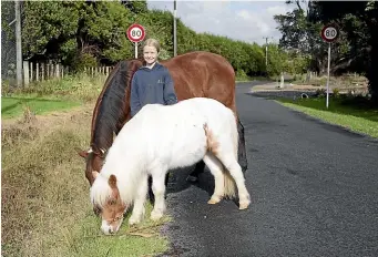  ?? ANDY JACKSON/STUFF ?? Omata School pupil Millie Stonier, 11, has started a petition to reduce the speed limit on her road, Waireka Rd East in Omata, down to 50kmh.