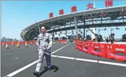  ?? EDMOND TANG / CHINA DAILY ?? A bridge toll gate in Zhuhai. The bridge opens to traffic on Wednesday.
