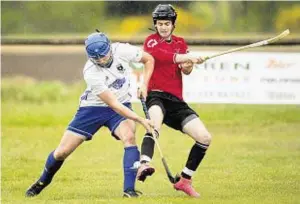  ??  ?? Up for grabs: Glasgow Mid Argyll’s Ryan Harrison, left, challenges for the ball against Lovat’s Calum MacAulay in the match at Kiltarlity