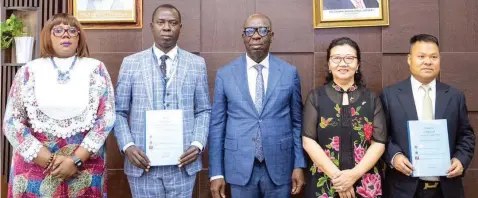  ?? ?? Edo State Commission­er for Education, Dr Joan Oviawe ( left); Rector, Edo State Polytechni­c, Usen, Sylvester Omoruyi; Governor Godwin Obaseki; Chinese Consular- General in Lagos, Yan Yu Qing and Protocol Secretary to the Consular- General, Xie Yijim, during the signing of an agreement to boost vocational and technical education in the state, at the Government House, Benin City… yesterday.