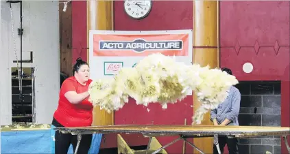  ?? PHOTO: SAMUEL WHITE ?? Winning throw . . . Chenell Waihape, of Mataura, was crowned the junior woolhandli­ng champion at the Otago Shearing and Woolhandli­ng Championsh­ips, in Balclutha yesterday.