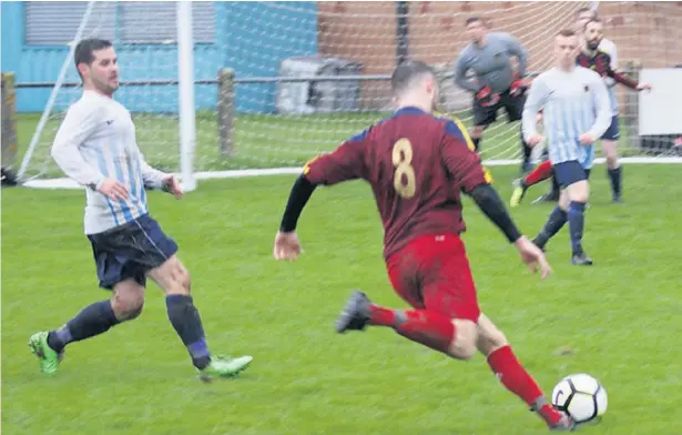  ??  ?? ●●Action from the Lancashire and Cheshire League game between Bedians (in red) and North Walkden