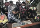  ?? Photo: Ivan Villanueva/EPA-EFE ?? Relatives surround the coffin of journalist Armando Linares López at his funeral in Zitácuaro on 16 March. The director of the Monitor Michoacán portal was killed at his home. Fellow journalist­s demanded justice.