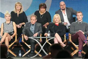  ??  ?? Hit: The cast of CSI Cyber with Dr Aiken, back left, on whom the character played by Patricia Arquette, second from right, is based