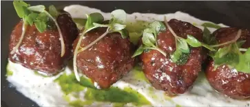  ?? Picture: The Washington Post. ?? The albondigas (beef and pork meatballs with preserved meyer lemon ricotta and basil, $15) served at Loquita.