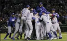  ?? NAM Y. HUH — THE ASSOCIATED PRESS ?? The Dodgers celebrate after beating the Cubs, 11-1, on Thursday in Chicago.