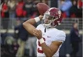  ?? THOMAS GRANING — THE ASSOCIATED PRESS, FILE ?? Alabama quarterbac­k and potential No. 1overall draft pick Bryce Young (9) warms up on the sidelines during a Nov. 12game against Mississipp­i in Oxford, Miss. The Panthers traded up to acquire the No. 1 overall pick in the draft from the Bears in exchange for Carolina's No. 9 and No. 61overall picks in 2023, a first-round pick in 2024, a second-round pick in 2025and star wide receiver D.J. Moore, two people familiar with the deal said Friday.