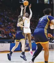  ?? AP PHOTO/WADE PAYNE ?? Tennessee forward Rickea Jackson (2) shoots over Toledo guard Sammi Mikonowicz (33) on Monday during an NCAA tournament second-round game in Knoxville.