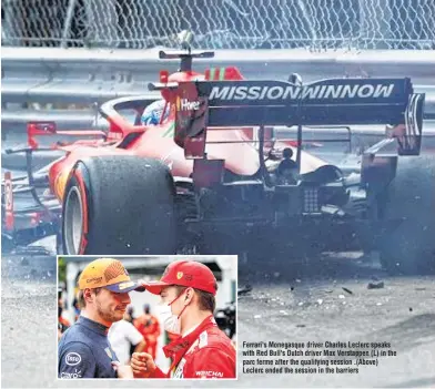  ??  ?? Ferrari's Monegasque driver Charles Leclerc speaks with Red Bull's Dutch driver Max Verstappen (L) in the parc ferme after the qualifying session .(Above) Leclerc ended the session in the barriers