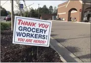  ?? MARK CAVITT — THE OAKLAND PRESS ?? A sign posted in front of a Kroger store in Plymouth.