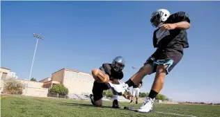  ??  ?? Jaguars kicker Jonathan Castaneda connects Monday during practice at Capital.