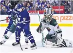  ?? FRANK GUNN THE CANADIAN PRESS ?? Maple Leafs centre John Tavares tries to locate the puck in front of Minnesota goalie Devan Dubnyk during Thursday’s in Toronto.