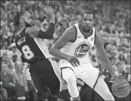  ?? BEN MARGOT / AP ?? Golden State Warriors' Kevin Durant drives the ball around San Antonio Spurs' Patty Mills during Game 1 of their NBA quarterfin­al playoff series on Saturday in Oakland, California.