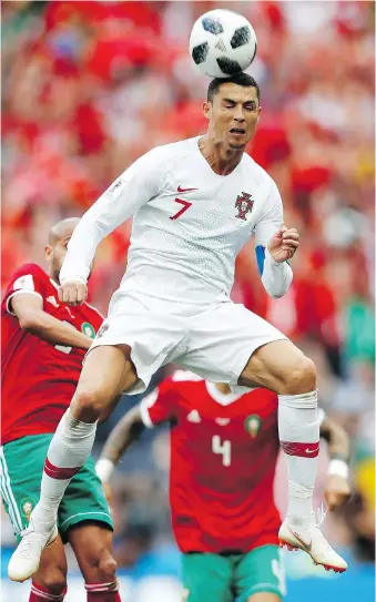  ?? FRANCISCO SECO/THE ASSOCIATED PRESS ?? Portugal star Cristiano Ronaldo continues to make up for his team’s ordinary play with the only goal of the match Wednesday in a 1-0 win over Morocco at Luzhniki Stadium in Moscow.
