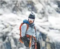  ?? Rob Bradford, courtesy of the upcoming film “Bombardier Blood” ?? Chris Bombardier, who has severe hemophilia B, stood atop the world’s highest peak on May 22. “A surreal experience,” he said.