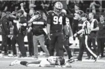  ?? Butch Dill / Associated Press ?? Eagles receiver Alshon Jeffery lies on the turf in front of the Saints’ Cameron Jordan after failing to catch a crucial late pass.