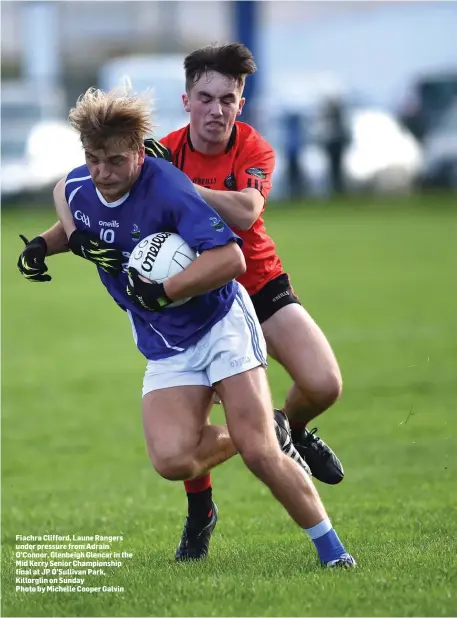  ??  ?? Fiachra Clifford, Laune Rangers under pressure from Adrain O’Connor, Glenbeigh Glencar in the Mid Kerry Senior Championsh­ip final at JP O’Sullivan Park, Killorglin on SundayPhot­o by Michelle Cooper Galvin