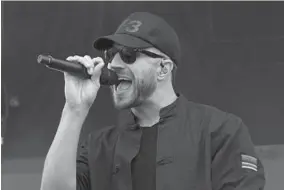  ?? KEVIN RICHARDSON/BALTIMORE SUN ?? Coountry-pop artist Sam Hunt sings in the infield as part of the music lineup for the 142nd Preakness. Zedd, LoCash, High Valley and Good Charlotte also performed.