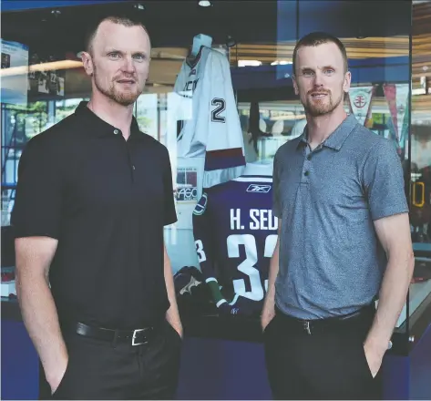  ?? NICK PROCAYLO ?? Henrik, left, and Daniel Sedin say having a place in the B.C. Hall of Fame is a tribute to their families as well.