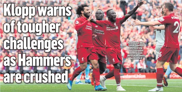  ??  ?? Red wave: Mo Salah opened the scoring for Liverpool as new look West Ham werebeaten 4-0