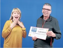  ?? ONTARIO LOTTERY AND GAMING PHOTO ?? Mary Richardson and Tim Noble picked up their winnings Tuesday at the Ontario Lottery and Gaming Prize Centre in Toronto.