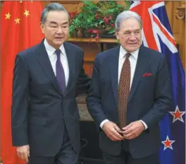  ?? HAGEN HOPKINS / POOL PHOTO VIA AP ?? Foreign Minister Wang Yi (left) meets with his New Zealand counterpar­t Winston Peters in Wellington on March 18.