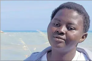  ?? AP PHOTO ?? A Nigerian woman, who asked to be identified only by her initials, S. J. speaks with The Associated Press in an interview outside the migrant processing centre in Pozzallo, Southern Italy. S. J., whose 5-month-old baby died when the dinghy they were...