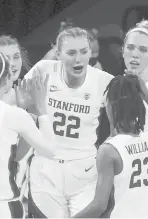  ?? ISAAC BREKKEN/AP ?? Stanford forward Cameron Brink (22) is congratula­ted by teammates after scoring against Oregon State during the second half in the semifinal round of the Pac-12 women’s tournament March 5 in Las Vegas.