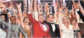  ??  ?? Host James Corden, center, is joined by casts of nominated musicals at the 73rd annual Tony Awards on Sunday.