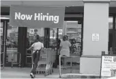  ?? Tribune News Service/getty Images ?? A Now Hiring sign hangs near the entrance to a Winn-dixie Supermarke­t on Sept. 21 in Hallandale, Florida.