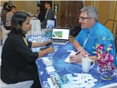  ?? Photo: Tourism Fiji ?? Sofitel Fiji Resort &amp; Spa director of Sales and Marketing, Michael Bell (right) assisting a guest during the annual India Roadshow in India