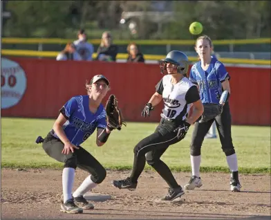  ?? Terrance Armstard/News-Times ?? Safe: Parkers Chapel’s Kylie Jones (3) watches as teammate Allison Rogers (6) tries to catch the ball before Smackover’s Tessa Watson takes second base during their game in Norphlet on Friday.