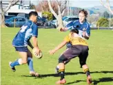  ??  ?? Fullback Shay Hewitt takes the inside pass from his wing to progress upfield.