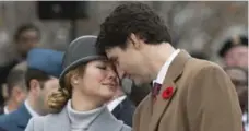  ?? ADRIAN WYLD/THE CANADIAN PRESS FILE PHOTO ?? According to a Forum poll released Friday, Prime Minister Justin Trudeau, pictured with his wife, Sophie, has a 57-per-cent approval rating.