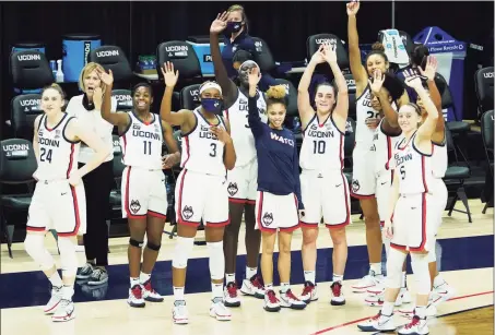  ?? David Butler II / Associated Press ?? UConn players wave to family and friends after Saturday’s win over Providence at Gampel Pavilion in Storrs.