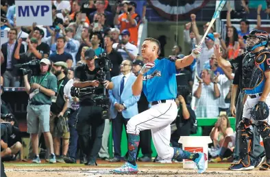  ?? ROB CARR / GETTY IMAGES / AFP ?? Aaron Judge of the New York Yankees follows through on a blast that traveled more than 500 feet en route to winning Monday’s All-Star Home Run Derby at Marlins Park in Miami, Florida. The 6-foot-7, 282-pound Judge leads the majors with 30 round-trippers.