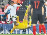  ?? BEN STANSALL AFP/GETTY IMAGES ?? Midfielder Jesse Lingard, who opened the scoring for England, keeps one out behind goalkeeper Jordan Pickford on Sunday.