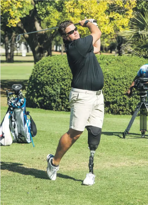  ?? Picture: SASPA ?? HAVING A SWINGING TIME. Byron Calvert drives down the fairway during a practice round ahead of the 2015 Nedbank SA Disabled Golf Open, which takes place from Monday to Wednesday next week at the Zwartkop Country Club.