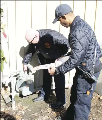  ?? Brodie Johnson • Times-Herald ?? The Forrest City Fire Department has added a community risk reduction division that includes the city’s code enforcemen­t office. FCFD Fire Marshal and Division Chief Jeremy Sharp, left, and Captain Chris Ray inspect a gas line at a local business.