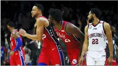  ?? MATT ROURKE — THE ASSOCIATED PRESS ?? The 76ers’ Joel Embiid, center right, celebrates with Ben Simmons, center left, after Simmons hit a 3-pointer to end the second quarter of an exhibition game against the Guangzhou Loong-Lions last week.