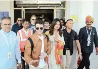  ?? Reuters ?? Priyanka Chopra and Nick Jonas wave as they arrive at the airport in Jodhpur on Thursday.