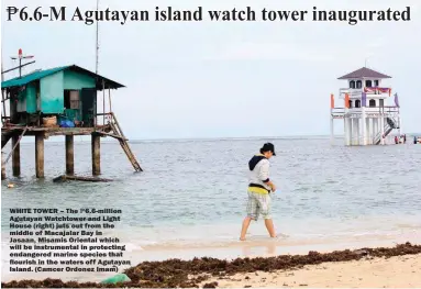  ??  ?? WHITE TOWER – The Agutayan Watchtower and Light House (right) juts out from the middle of Macajalar Bay in Jasaan, Misamis Oriental which will be instrument­al in protecting endangered marine species that flourish in the waters off Agutayan Island....