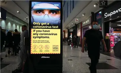  ??  ?? Government messages about the coronaviru­s pandemic in a shopping centre in Leeds. Photograph: Oli Scarff/AFP/Getty Images