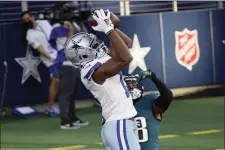  ?? MICHAEL AINSWORTH – THE ASSOCIATED PRESS ?? Dallas Cowboys wide receiver Michael Gallup catches a touchdown pass as overmatche­d Eagles cornerback Michael Jacquet tries to defend in the first half Sunday in Arlington, Texas.