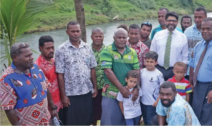  ?? Ronald Kumar ?? Attorney-General Aiyaz Sayed-Khaiyum with Naveicovat­u villagers of Tailevu and his sons, Ibrahim and Idris, on September 10, 2019 following the launch of the Global Commission and Adaptation Flagship Report. Photo: