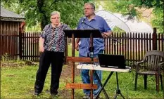  ?? Steve Barnes / Times Union ?? Mary Liz and Paul Stewart, founders of the Undergroun­d Railroad Education Center at the Stephen and Harriet Myers Residence in Albany, speak at theannual July 4 Oration. The event honors abolitioni­st Frederick Douglass.