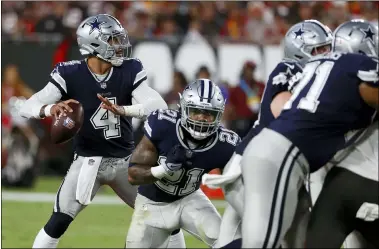  ?? SCOTT AUDETTE — THE ASSOCIATED PRESS ?? Cowboys quarterbac­k Dak Prescott looks to pass against the Buccaneers during the first half Sept. 9in Tampa, Fla.