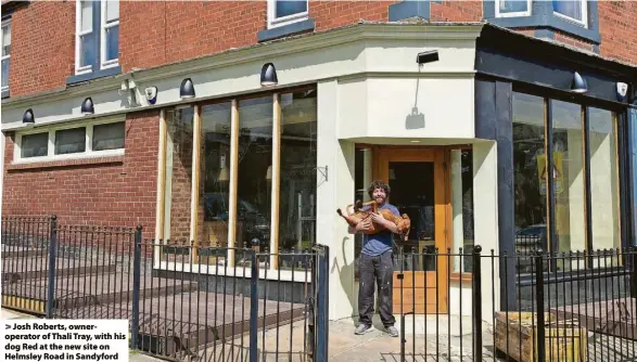  ?? ?? > Josh Roberts, owneropera­tor of Thali Tray, with his dog Red at the new site on Helmsley Road in Sandyford