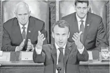  ?? Andrew Harrer / Bloomberg ?? French President Emmanuel Macron speaks to a joint meeting of Congress, calling for the U.S. to re-enter the climate treaty.