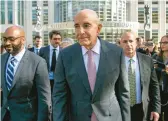  ?? TED SHAFFREY/AP ?? Tom Barrack, center, leaves Brooklyn Federal Court in New York on Friday. He was accused of using his access to former President Trump to push UAE interests.
